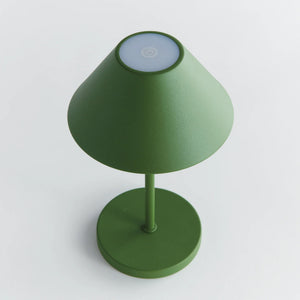 The NAPA HOME AND GARDEN - ALLUNA 10” Cordless LED Lamp in green, a compact and modern luxury table lamp featuring a metal conical shade and a round base, is displayed against a plain white background.