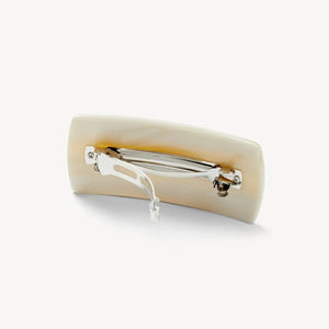 The MACHETE Jumbo Box Barrette in Alabaster, by MACHETE, is a rectangular ivory-hued hair accessory with smooth edges, shown on a plain white background.