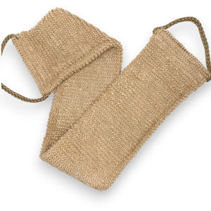 A close-up of the SMILE BOUTIQUES NATURAL ORGANIC JUTE BACK SCRUBBER, featuring a brown, woven jute design with a braided handle at one end and laid flat on a white background—this handmade bath accessory offers a sustainable upgrade to your shower routine.