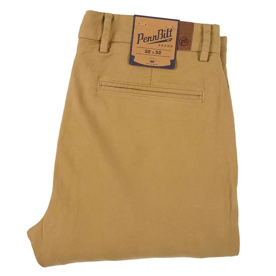 Close-up of PENNBILT - THE PLAINSMAN PANT IN DARK KHAKI, featuring tan Pima cotton fabric with a partially unzipped brass zipper and an open button. A blue “PENNBILT” label is sewn near the waistband.