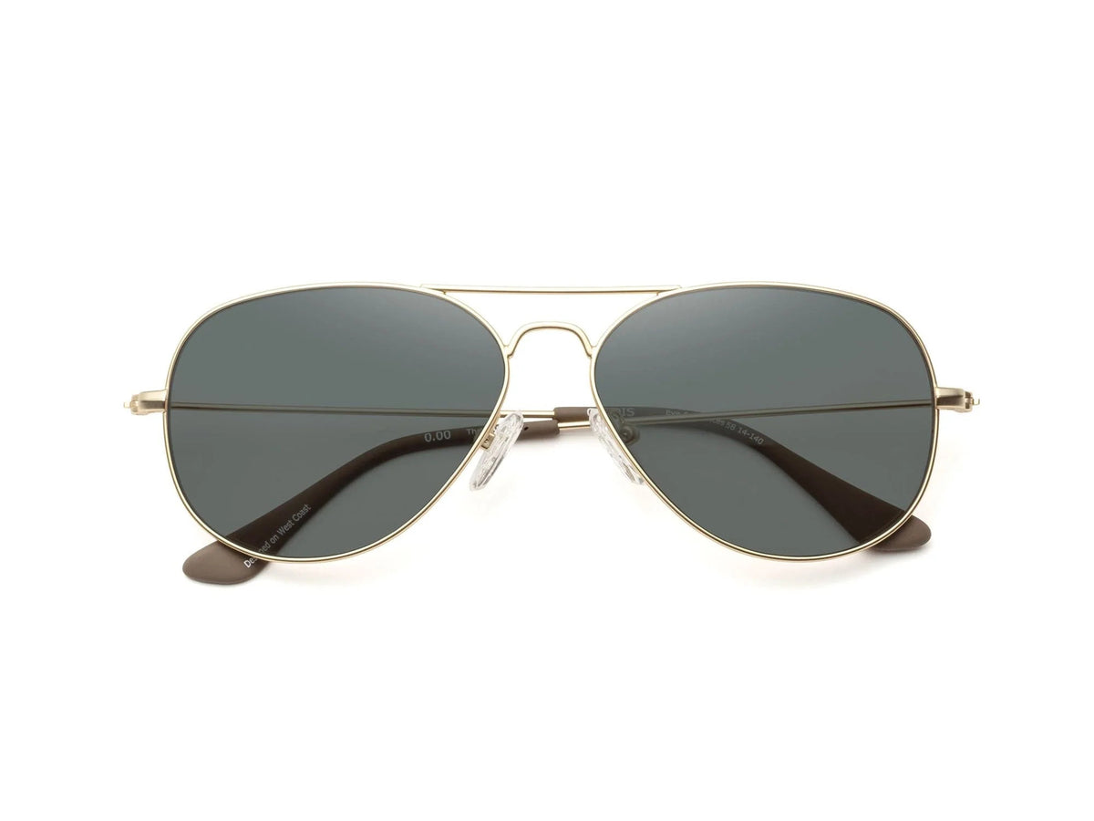 The CADDIS - MABUHAY SUNGLASSES by CADDIS feature a thin gold wire frame, scratch-resistant dark lenses, and brown temple tips, displayed against a white background.