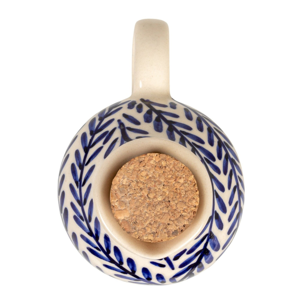 The HAND-PAINTED STONEWARE OIL CRUET WITH CORK STOPPER by CREATIVE COOP features blue leaf patterns and a handle, making it a perfect addition to rustic kitchen decor. Shown on a white background with the cork beside it.