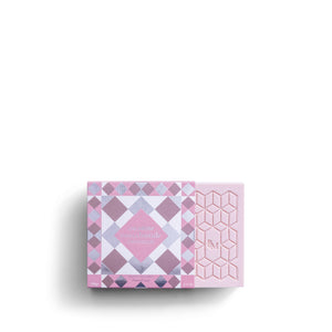 The ROSE ET MARIUS "A Siesta in a Sunlit Home" scented soap gift box features a pale pink, square soap with a geometric raised pattern and "RM" embossed in the center, shown against a white background.