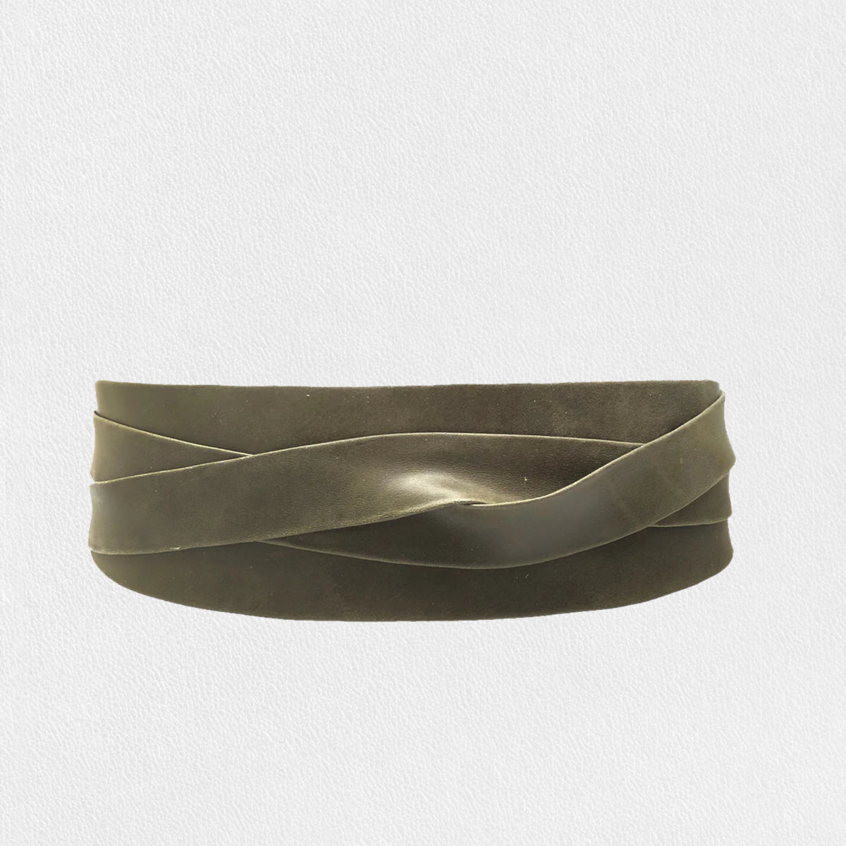 An olive wrap belt by ADA features a twisted, ribbon-like design resembling an elegant coiled metal strip against a white backdrop.
