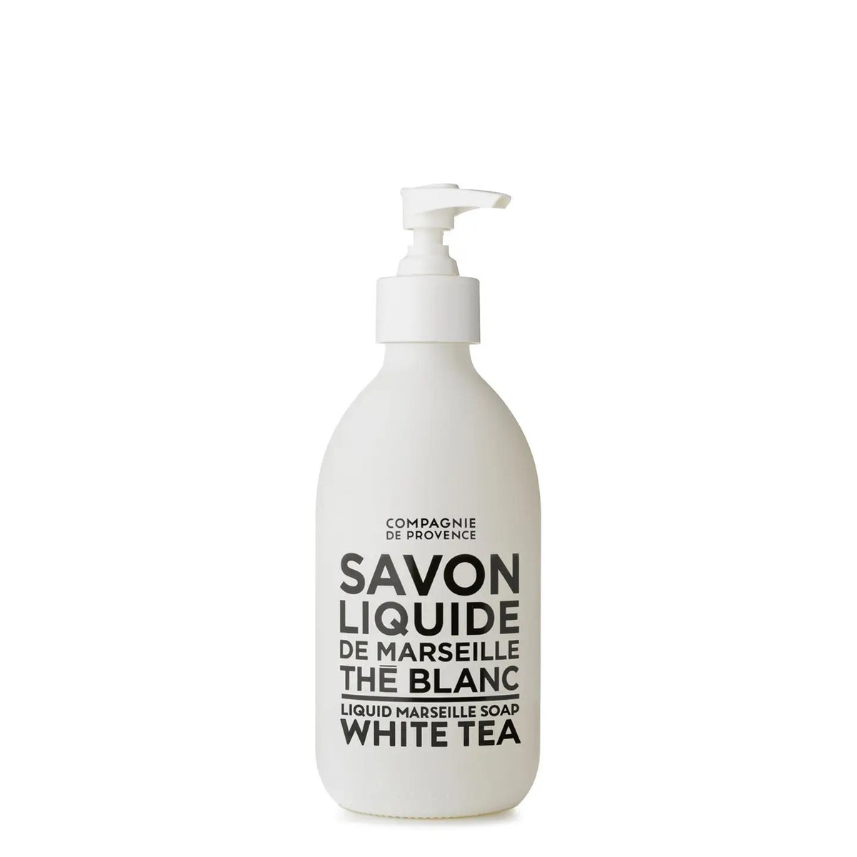 A white pump bottle labeled &quot;COMPAGNIE DE PROVENCE - SAVON LIQUIDE DE MARSEILLE WHITE TEA SOAP&quot; offers a delightful fragrance. Infused with botanical oils, the brand &quot;CIE LUXE BRANDS&quot; is elegantly displayed at the top.