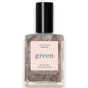 A close-up of a brush spreading MANUCURIST - GREEN™ NAIL POLISH IN QUARTZ by MANUCURIST INC, showcasing its shimmery, metallic brown vegan formula with visible sparkles and swirling patterns.