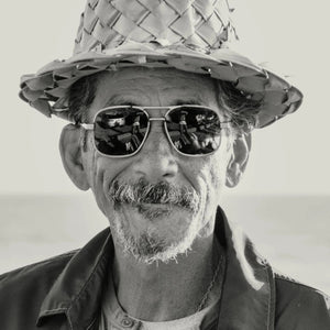 Front view of CADDIS - METAMODERNIST SCOUT SUNGLASSES by CADDIS, featuring an aviator-style sleek metal alloy frame and dark green premium tinted lenses, displayed on a white background.