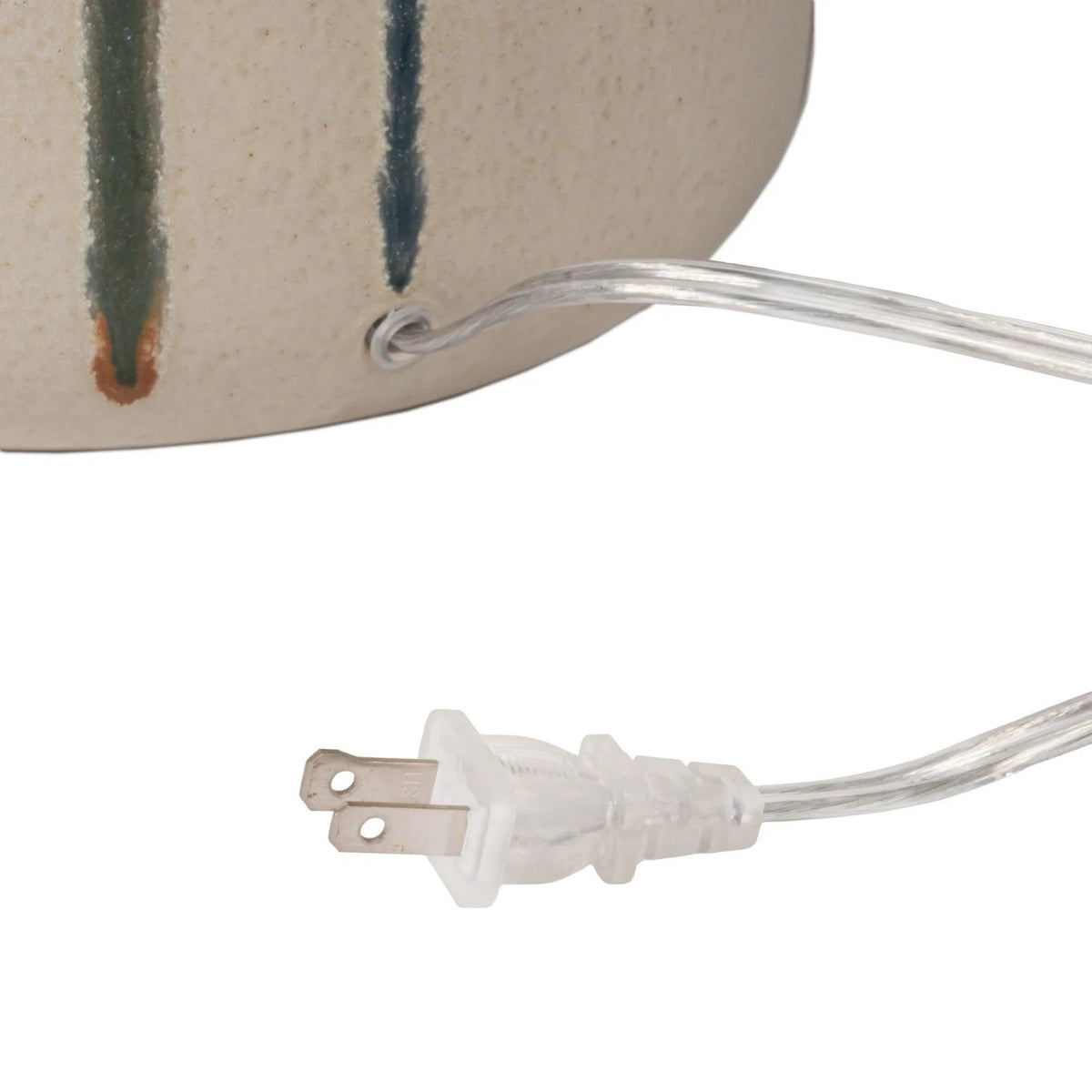 The CREATIVE COOP Stoneware Table Lamp features a textured beige linen shade and a ceramic base with artisan green and brown drip glaze over cream.