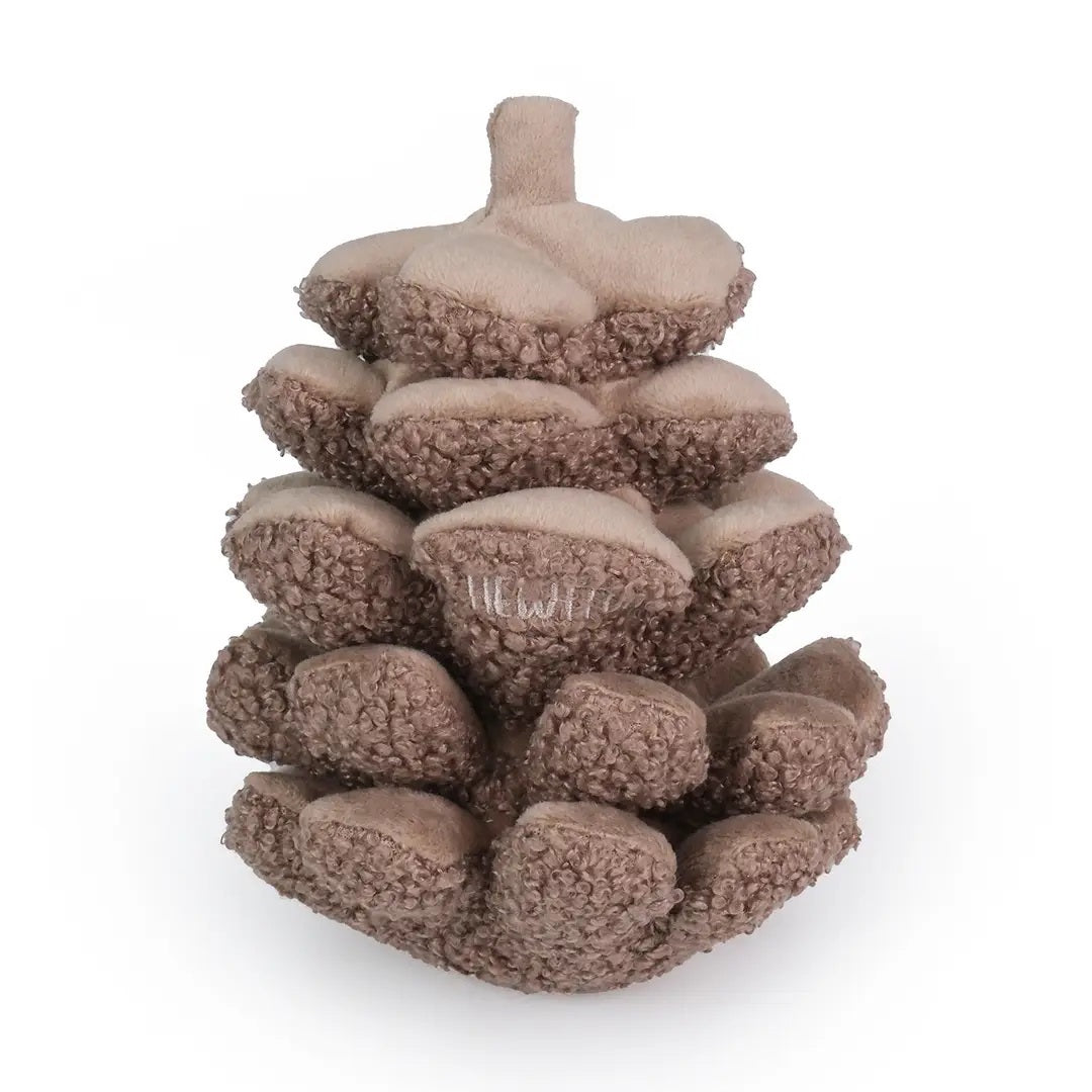 The CHEWFFON PINECONE SNUFFLE &amp; CRINKLE DOG TOY is a plush dog toy shaped like a brown pine cone, featuring a textured surface and a small embroidered label. Designed to promote dental hygiene while keeping your pup entertained, it is photographed on a plain white background.