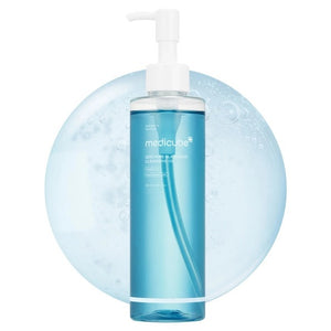 Two clear bottles of KOSMIC KBEAUTY SKINCARE MEDICUBE - ZERO PORE BLACKHEAD DEEP CLEANSING OIL, 205ML, filled with blue liquid, are displayed on a blue background. The accompanying text highlights its benefits for pore care, blackhead removal, and sebum control, showcasing how this deep cleansing oil effectively removes pore buildup for a refreshed complexion.
