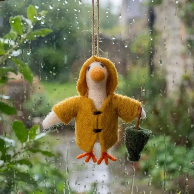 PUDDLES THE GOOSE ORNAMENT by FELT SO GOOD, a handcrafted felt goose wearing a yellow hooded raincoat and carrying a small green umbrella.