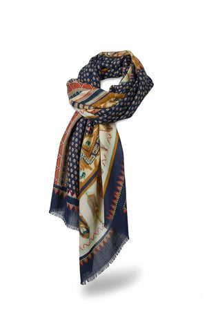 The STORIATIPIC ATHENA Wool Scarf with Embroidery in Marine features a harmonious mix of navy, yellow, and red hues with geometric and circular patterns. Loosely knotted with frayed edges, this patterned accessory by STORIATIPIC is showcased against a white background.