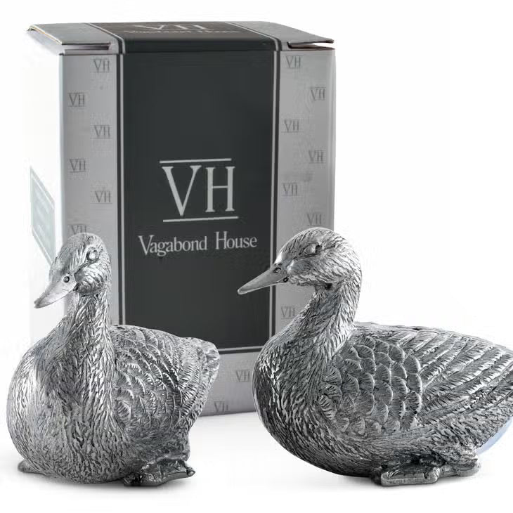 VAGABOND HOUSE&#39;s Pewter Duck Salt and Pepper Set showcases two ducks with detailed feather engravings, sitting slightly forward with dispensing holes on their backs.