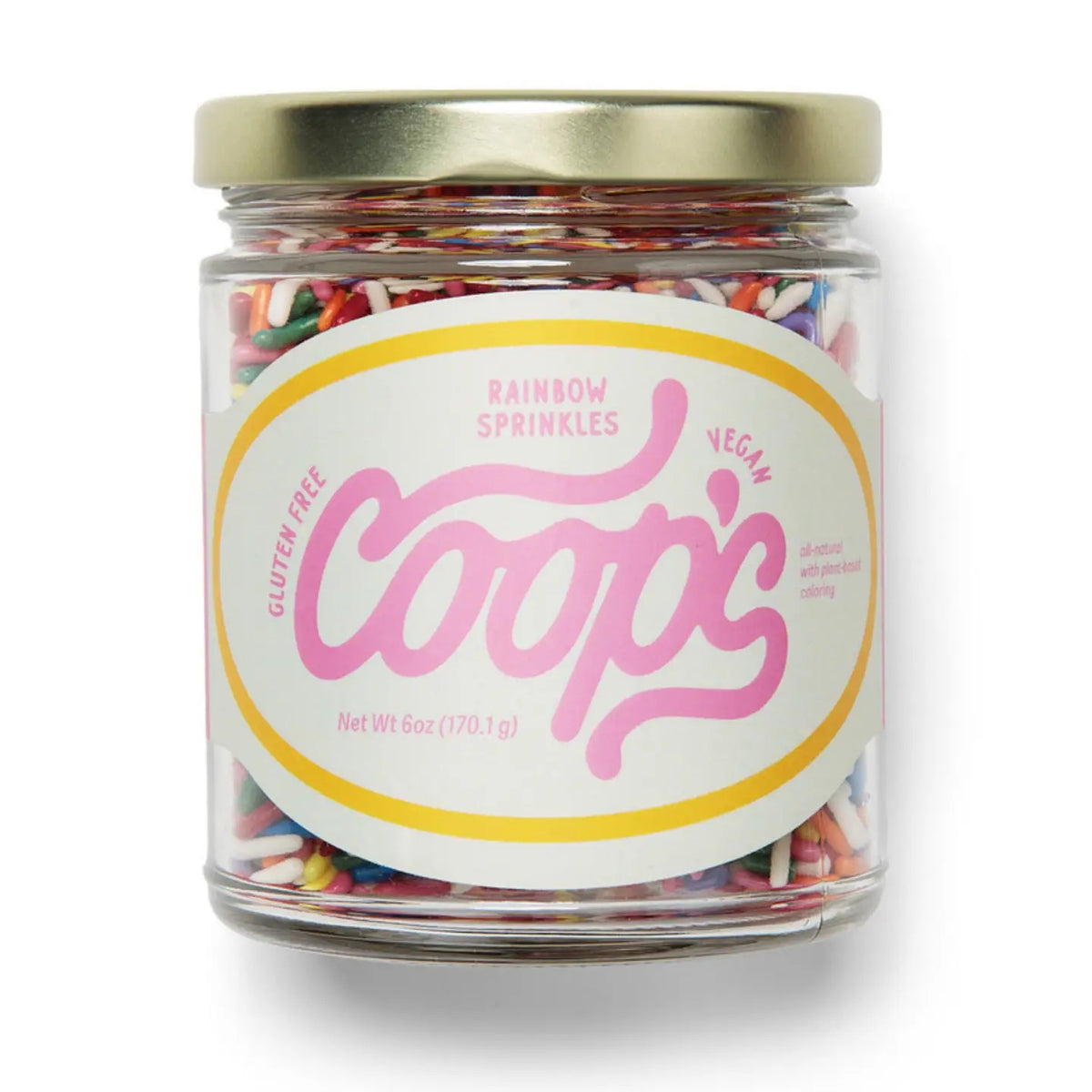 A clear glass jar with a white lid contains COOPS Rainbow Sprinkles, as indicated on the pink and yellow accented label. The label notes that these colorful vegan sprinkles from COOPS are also dairy-free and gluten-free.