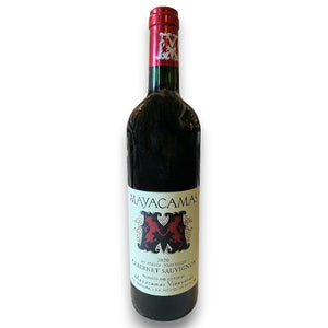 A bottle of MAYACAMAS CABERNET SAUVIGNON 2020 from WINE: KELLOGG SELECTIONS, featuring a red foil top, cream label, and bold red "M"—an outstanding Napa Valley wine.