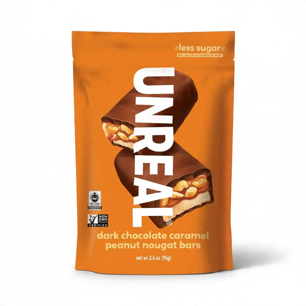 Orange wrapper featuring an UNREAL - DARK CHOCOLATE CARAMEL PEANUT NOUGAT BAR, a chocolate-covered caramel and peanut nougat snack.