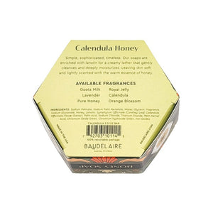 Hexagonal box of BAUDELAIRE - CALENDULA HONEY SOAP 3.5 OZ, featuring green floral packaging with a central clear window displaying the triple-milled moisturizing bar and a floral design label on top, by BAUDELAIRE.