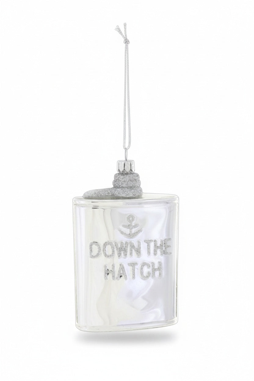Cody Foster GLASS SILVER FLASK ORNAMENT shaped like a flask, featuring an anchor icon and the glittery silver text “DOWN THE HATCH” to celebrate holiday spirits.