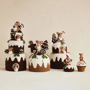 CREATIVE COOP HANDMADE FELT MOUSE ON CUPCAKE: Two styles—one mouse wears a Santa hat holding candy canes on a Christmas pudding, the other holds a swirl cookie on a cupcake with white icing and berries. Perfect for cake decorating.