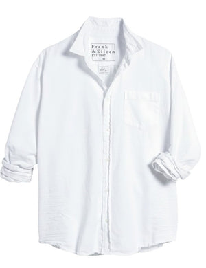 The FRANK & EILEEN LUKE Men's Button Up Shirt in Famous Denim White features long roll-up sleeves, a chest pocket, and a collar. The label reads "Frank & Eileen EST 1947." Displayed on a white background.