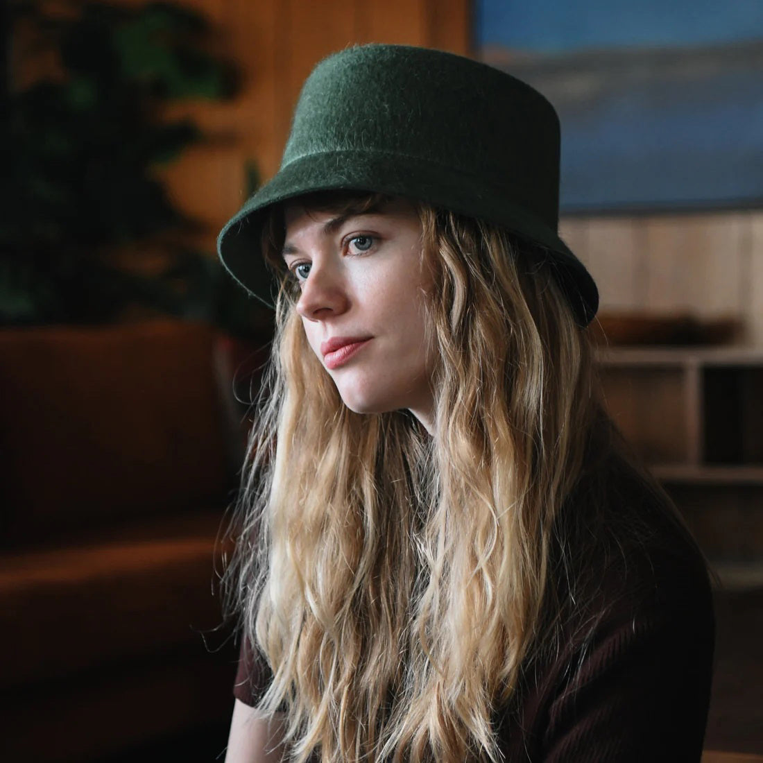 WYETH's TENLEY BUCKET HAT, a blue bucket hat made from fuzzy mohair wool and featuring a wide brim, is presented against a simple white background.