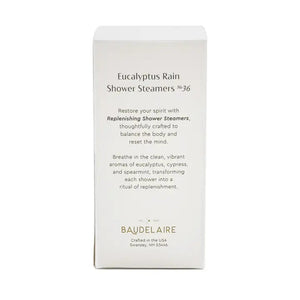A white box labeled “BAUDELAIRE - REPLENISH EUCALYPTUS RAIN SHOWER STEAMER” by BAUDELAIRE, featuring a window that displays stacked round blue and white shower steamers inside, provides a refreshing aromatherapy experience with the invigorating scent of eucalyptus.