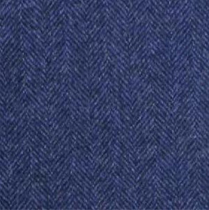 Close-up of the WIGENS Modern Wool Baseball Cap in Navy Herringbone, showcasing its textured blue fabric with a refined herringbone pattern—alternating diagonal lines create a chevron-like design, reflecting classic Italian textile heritage.