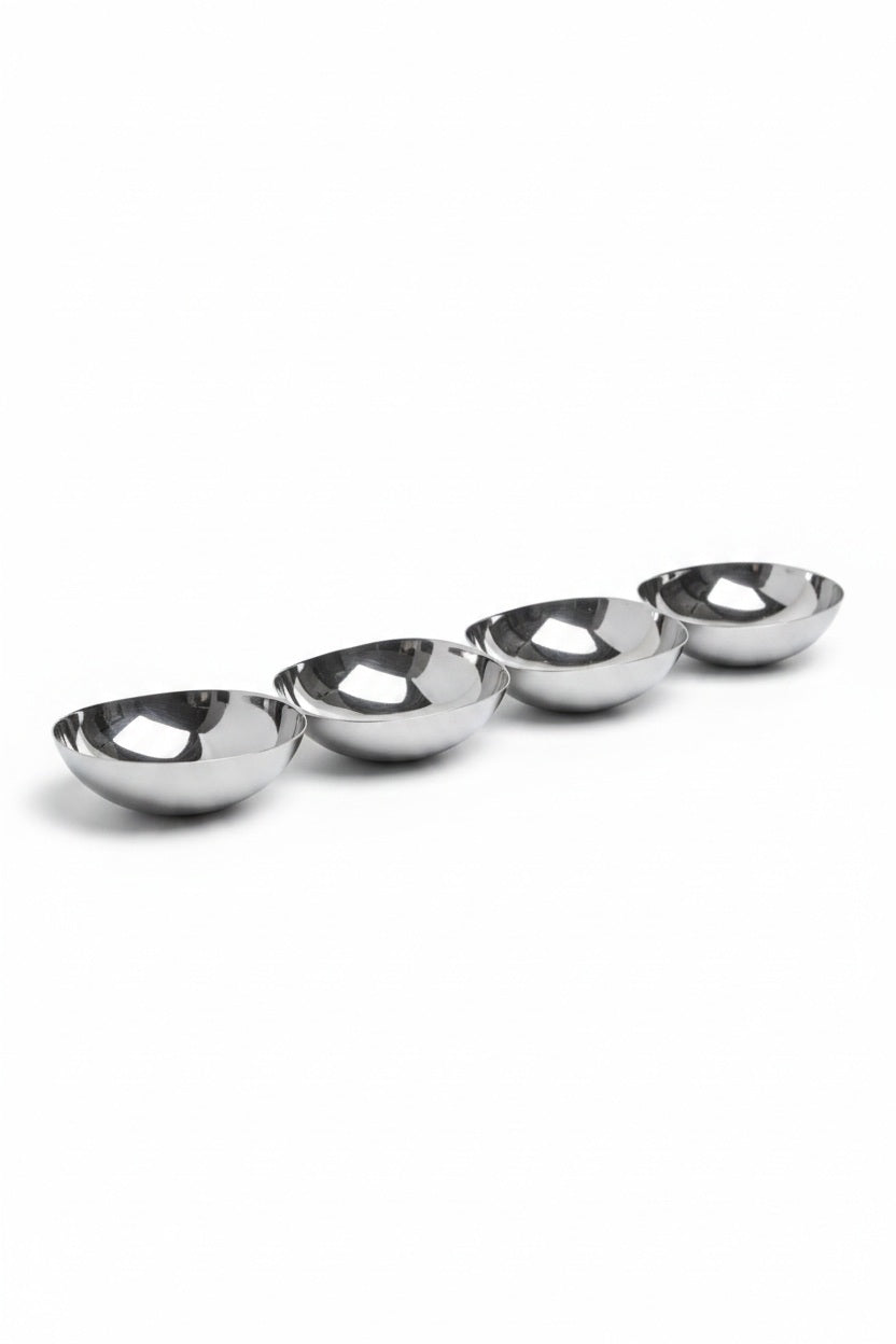 Four 15-inch silver-colored metal bowls arranged in a diagonal line, known as the ZODAX FOUR TIER NUT BOWL IN POLISHED NICKEL.
