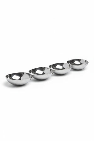 Four 15-inch silver-colored metal bowls arranged in a diagonal line, known as the ZODAX FOUR TIER NUT BOWL IN POLISHED NICKEL.