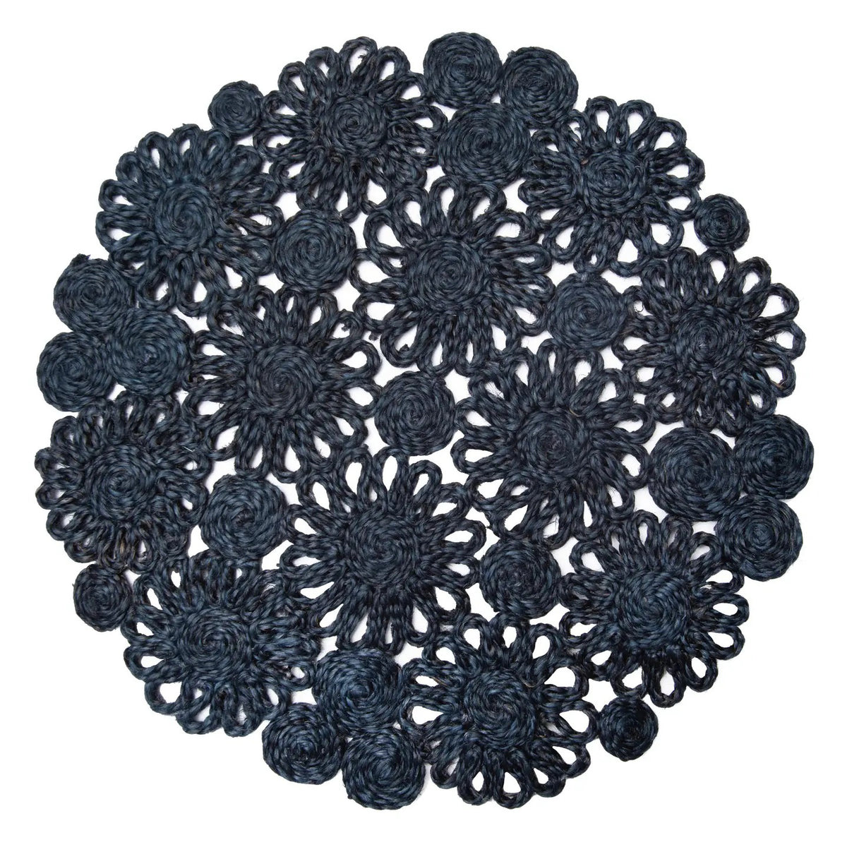 The COULEUR NATURE DAISY JUTE ROUND NAPKIN IN BLUE showcases a scalloped floral design with interconnected crochet patterns and circular motifs.