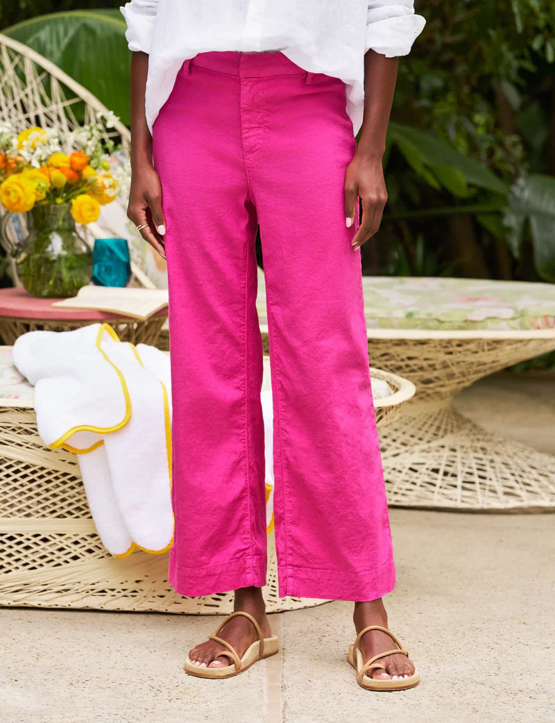The FRANK &amp; EILEEN Wexford Wide Leg Linen Pant in Guava features a bright pink hue, belt loops, and a concealed front closure, shown laid flat on a white background.