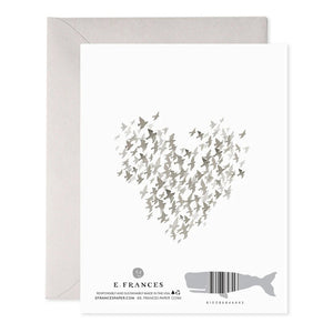 The E. FRANCES PAPER - STARLINGS CONDOLENCE GREETING CARD features a heart made of small gray birds on luxurious paper. Below, "SO SORRY" is printed in muted pink. An elegant envelope is partially visible behind the card.