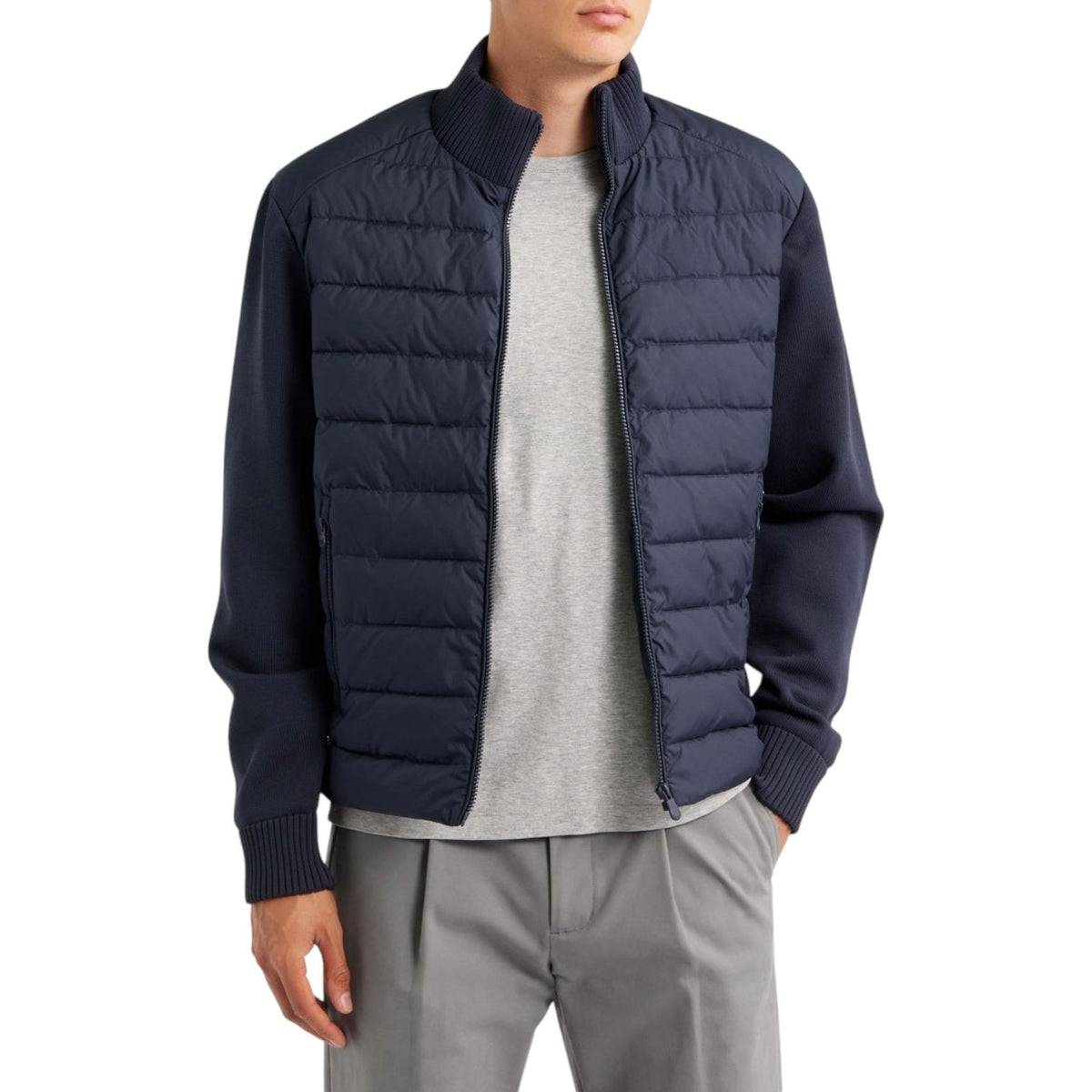 Close-up of a dark blue recycled polyester knit fabric with a uniform ribbed texture featured on the SAVE THE DUCK - SEDUM JACKET IN BLUE.