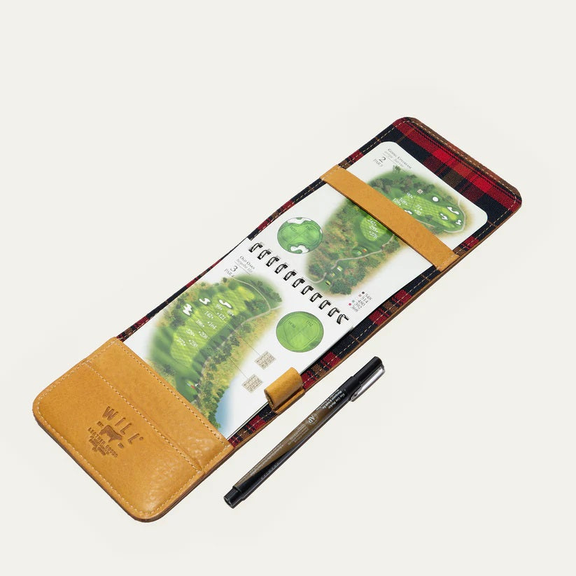 The WILL LEATHER GOODS - GOLF YARDAGE BOOK IN YELLOW features slim, yellow full-grain leather with visible stitching, styled like a classic yardage book and shown slightly open to reveal cards and cash against a white background.