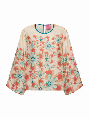 The FRANCO FERRARI - WIDE SLEEVE CORAL BLOUSE features a flowy, lightweight silk design with a floral print in teal, orange, and beige. Perfect for vacation dressing, it has a slightly sheer fabric with a round neckline and back button closure.