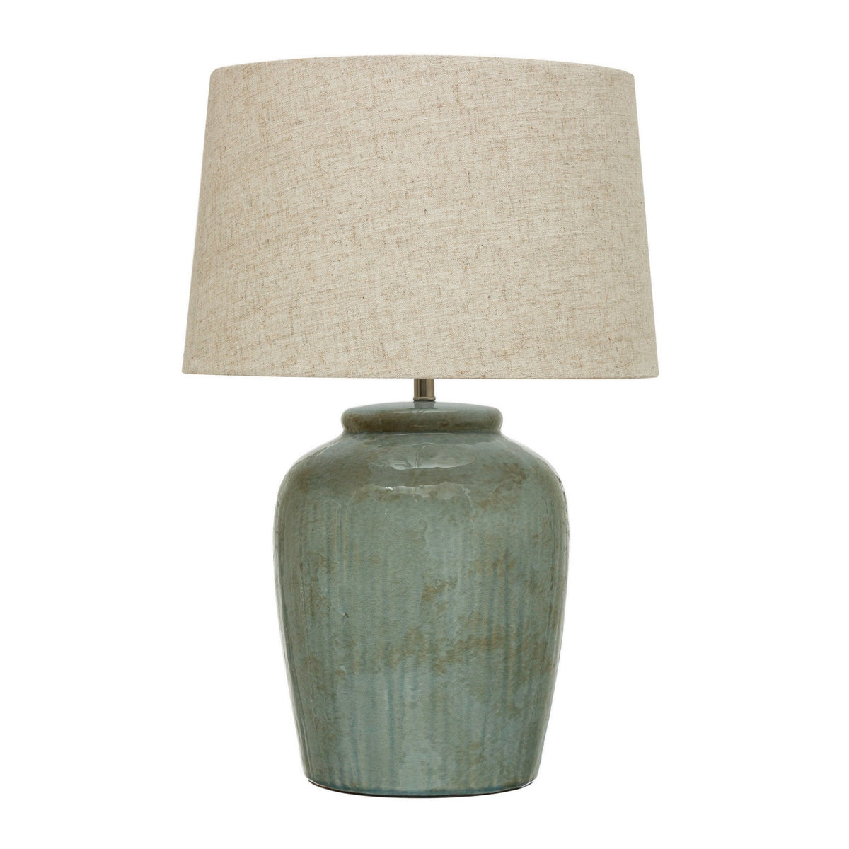 The CREATIVE COOP AQUA STONEWARE LAMP WITH LINEN SHADE features a nature-inspired design with a muted green textured ceramic base and a beige linen shade, set against a white background.