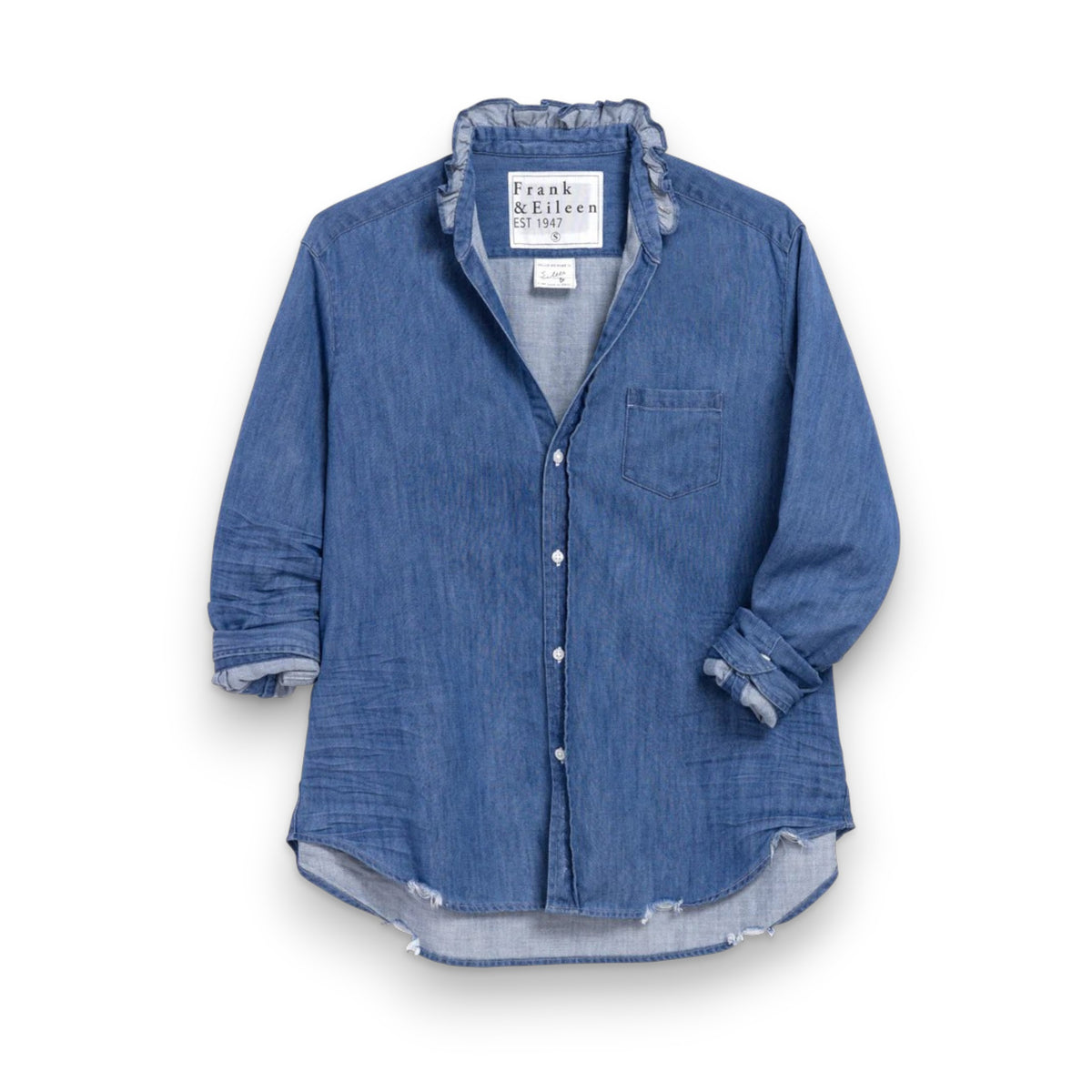 The FRANK &amp; EILEEN Ruffle Eileen Relaxed Button Up in Vintage Stonewashed Denim has rolled-up long sleeves, a casual frayed collar, front pocket, button-down front, and slightly curved hem. The label reads &quot;Frank &amp; Eileen EST 1947.
