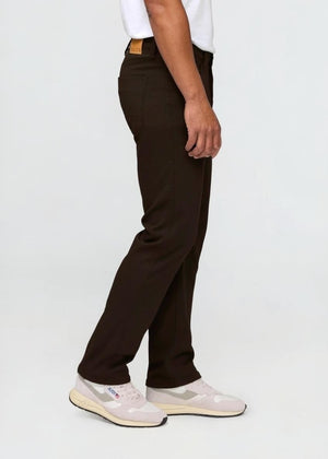 DU/ER - NO SWEAT STRAIGHT PANTS IN STOUT by DUER: Straight-leg, dark brown pants made from No Sweat fabric with front and back pockets, belt loops, and a button closure, shown on a white background.