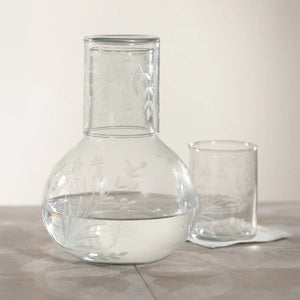The ZODAX SHIRAZ TUMBLER features an etched flower design on its clear cylindrical surface, displayed against a plain white background.