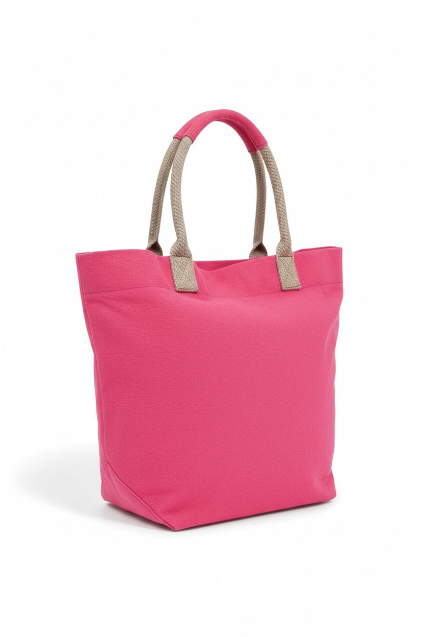 The TRAVAUX EN COURS CANVAS TOTE BAG is a versatile teal accessory with beige 100% cotton canvas handles. It features a spacious main compartment, with securely stitched handles ideal for carrying by hand or over the shoulder.