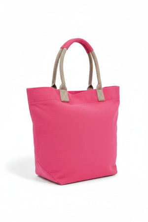 The TRAVAUX EN COURS CANVAS TOTE BAG is a versatile teal accessory with beige 100% cotton canvas handles. It features a spacious main compartment, with securely stitched handles ideal for carrying by hand or over the shoulder.