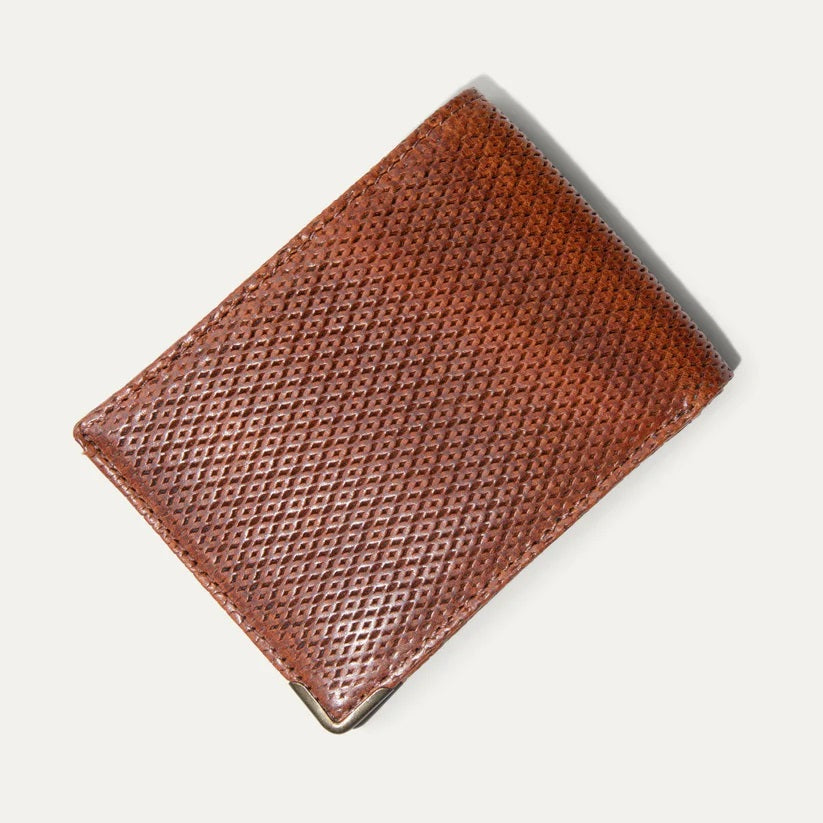 Two WILL LEATHER GOODS THE INDUSTRIALIST BILLFOLD wallets in ginger pindot full-grain leather are shown: one open with card slots and ID window, the other closed with an embossed dog logo on the bottom right corner.