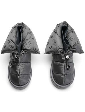 The METALLIC PILLOW BOOT by FLUFIE is a black, high-top winter boot with a padded, quilted design. It features a side zipper and a ridged sole, with the brand name "FLUFIE" embossed on the side of the sole. Insulated with goose down and boasting an anatomic insole, this boot is perfect for cold weather.