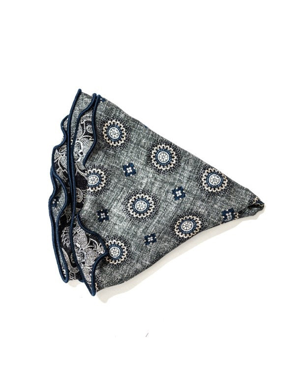 The EDWARD ARMAH Silk Reversible Pocket Circle in Grey Medallion features a blue and white medallion print with dark blue scalloped edges, displayed on a white background.