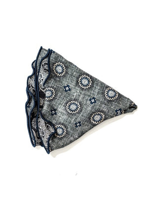 The EDWARD ARMAH Silk Reversible Pocket Circle in Grey Medallion features a blue and white medallion print with dark blue scalloped edges, displayed on a white background.