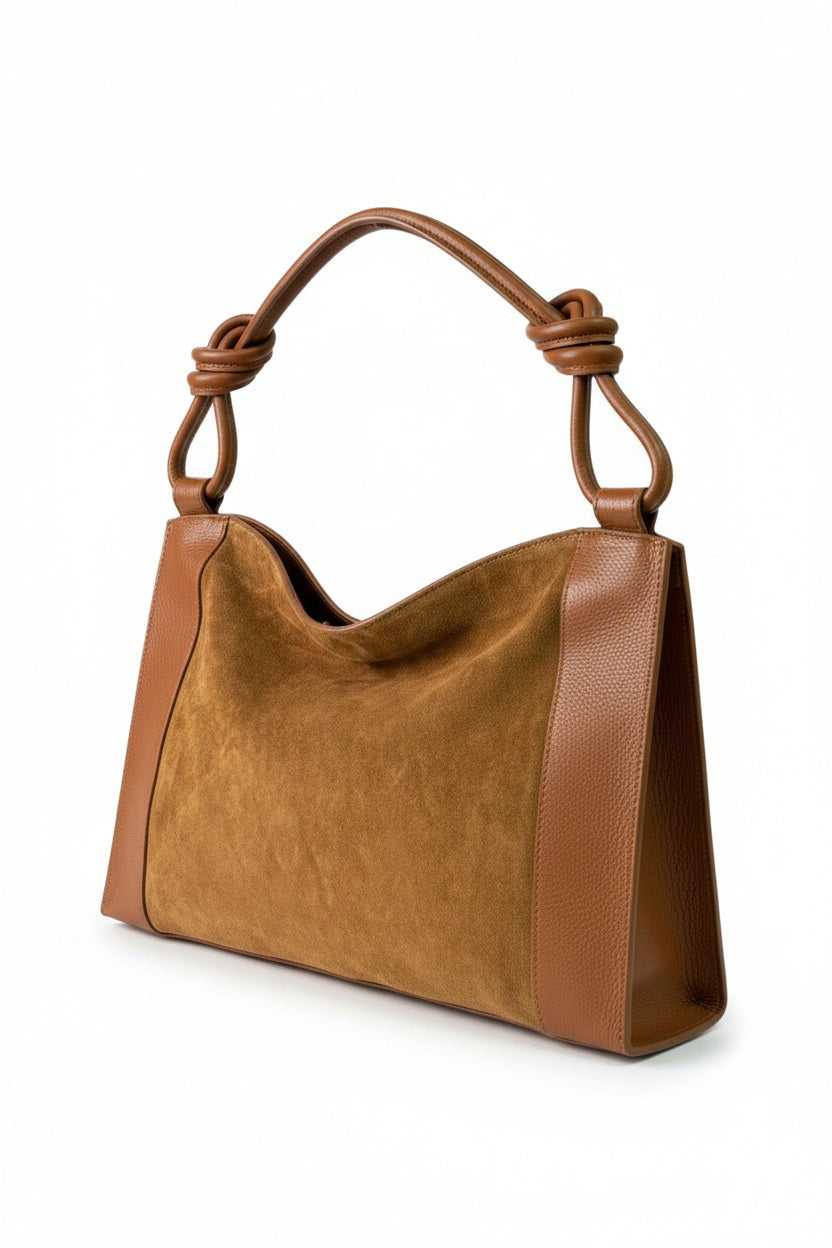 LE BORSETTE LEATHER AND SUEDE HANDBAG IN COGNAC, featuring a suede center panel with smooth leather sides and a knotted shoulder strap.