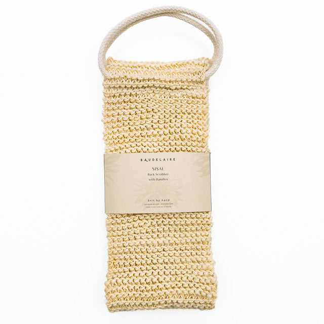 A handwoven back scrubber made of natural sisal is displayed on a white background. It has a looped handle at the top and an attached label that reads &quot;Baudelaire - Sisal Back Scrubber.&quot; The cream-colored scrubber, featuring a textured knit pattern for natural exfoliation, is part of the Baudelaire brand.