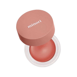 A single swatch of MINORI - CREAM BLUSH in Scarlet sweeps across a white background, revealing its creamy texture and rich pigment—capturing the effortless glow of a natural-looking blush from MINORI.