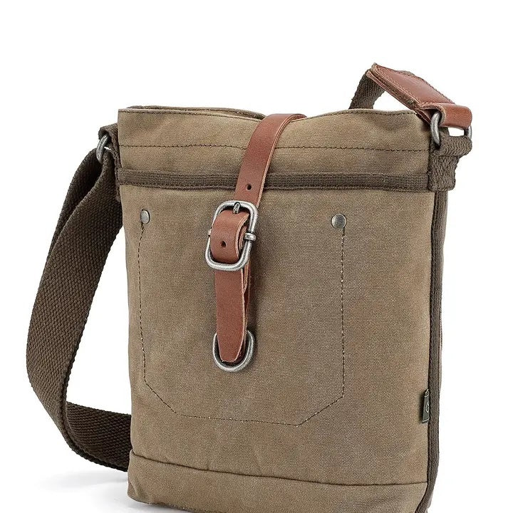 The TSD BRAND Forest Zip Crossbody Bag in olive features a khaki canvas design with a brown adjustable strap, front pocket, and brown leather strap with metal buckle and clasp—offering military-inspired style and practical utility.