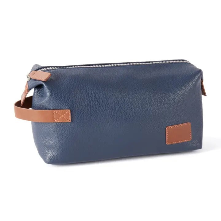 The VIENNA TOILETRY BAG IN NAVY by BEYBERK INTERNATIONAL features a rectangular navy blue leather design with brown accents, side handle, and top zipper closure, displayed on a plain white background.